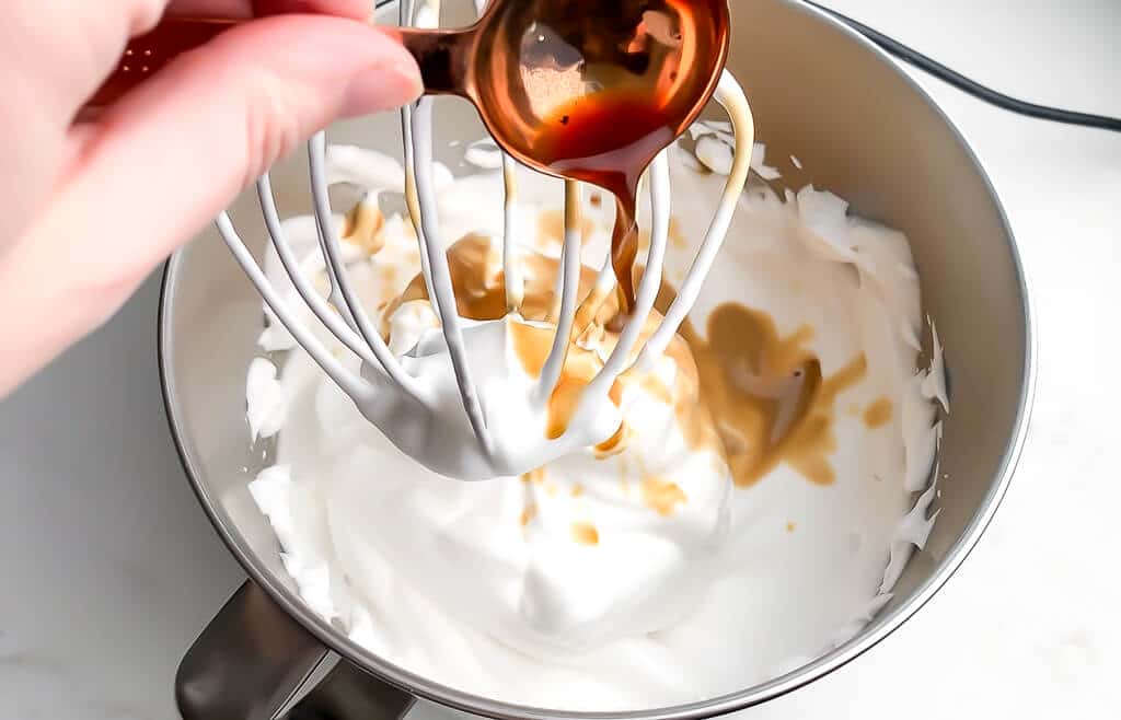 Adding 1 tbsp of vanilla extract to the aquafaba to make vanilla flavored whipped cream