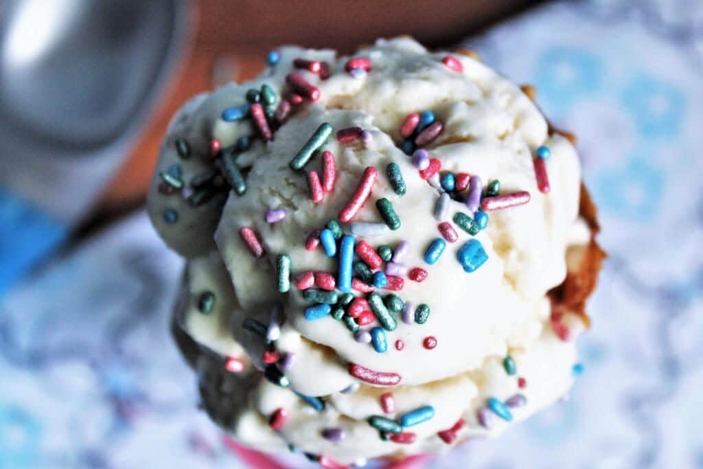 A top view of aquafaba ice cream with colorful sprinkles.