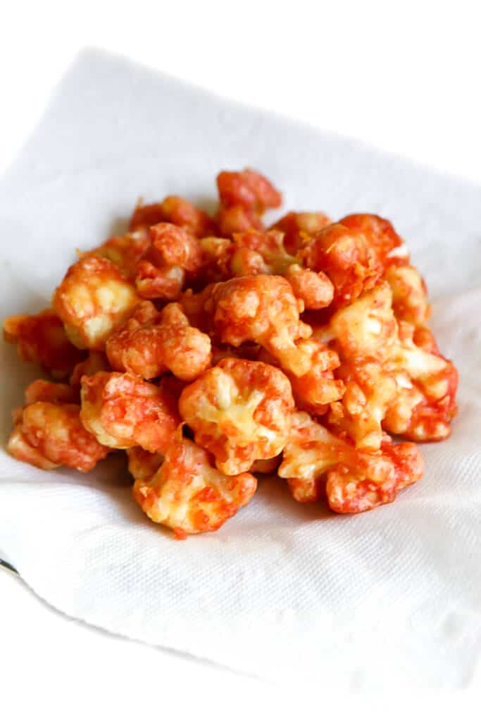 Deep fried seasoned cauliflower for making vegan buffalo cauliflower.