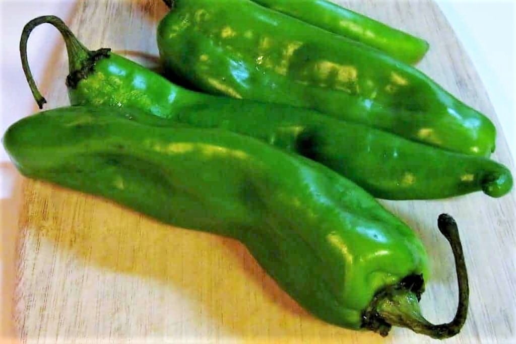 New Mexican Green Chiles on a cutting board.