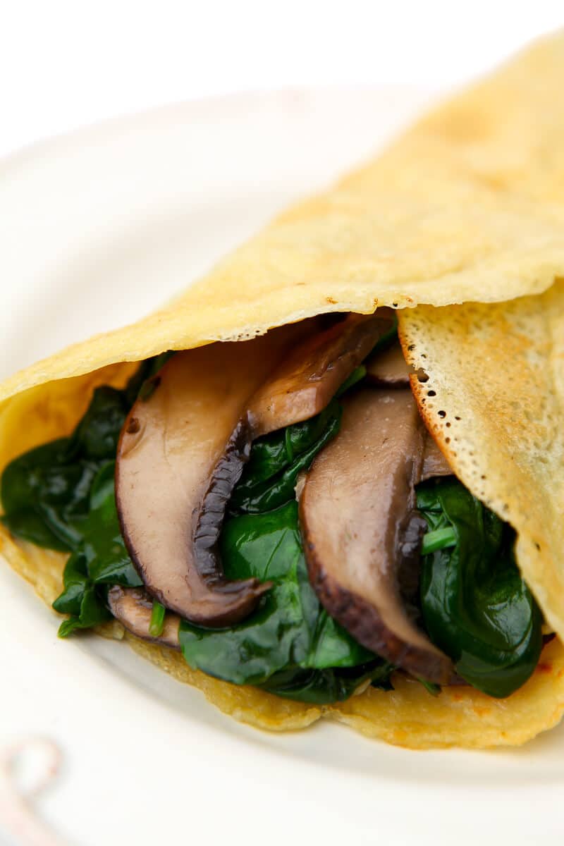 A crepe filled with sauted portabella mushrooms and spinach.