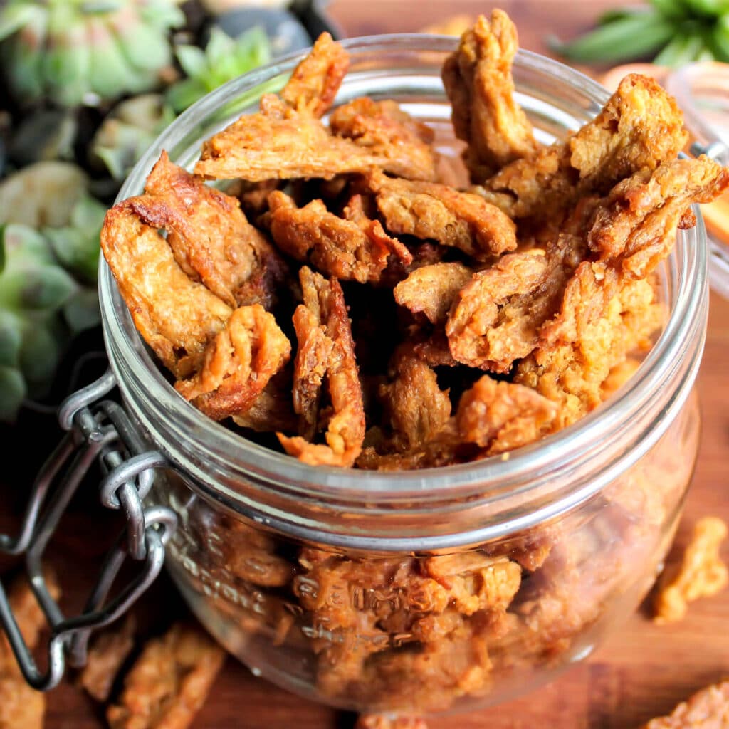 Vegan jerky made from soy curls in a mason jar.