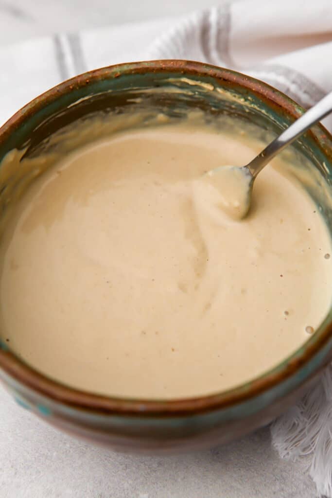Creamy tahini sauce once the water has been added.