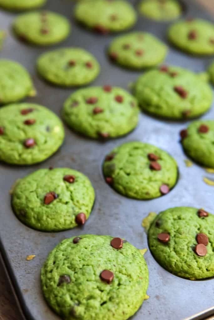 A tray of vegan spinach muffins after they come out of the oven.