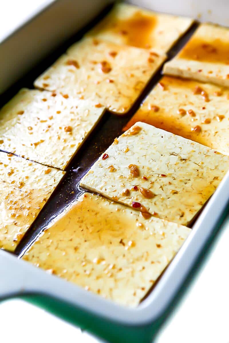 Tofu marinating in a teriyaki marinade.