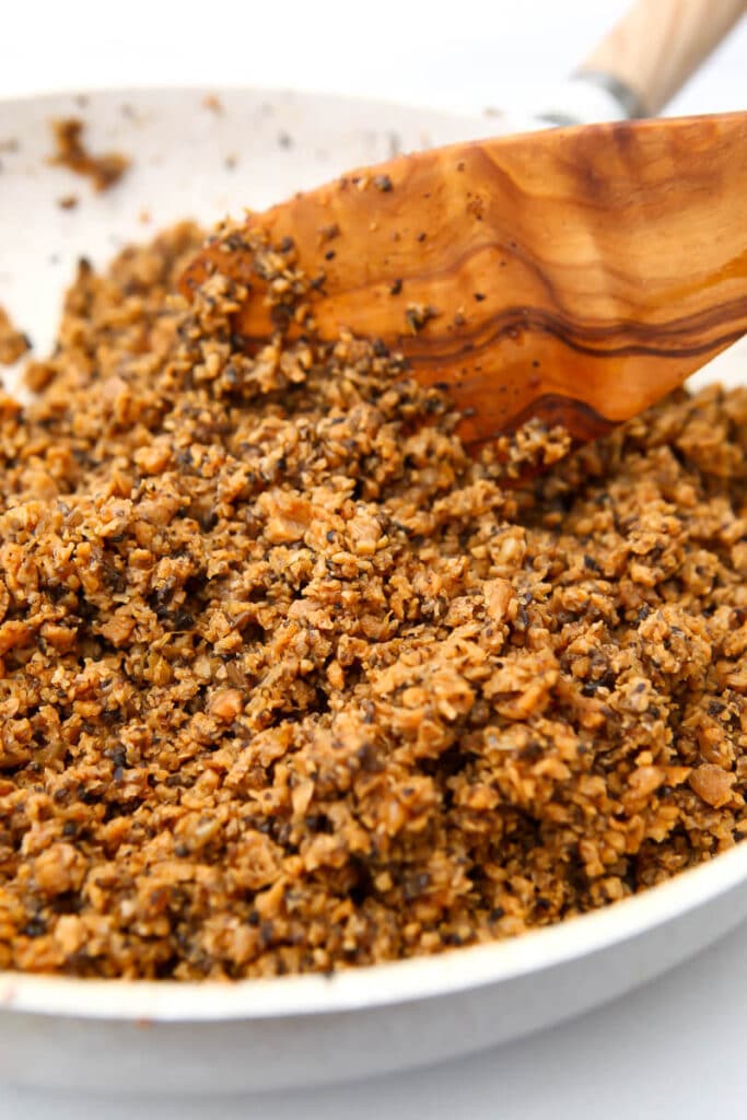 A close up of homemade meatless grounds in a white skillet.