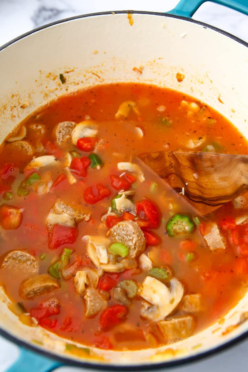 A pot of vegan jambalaya before the rice is done cooking.