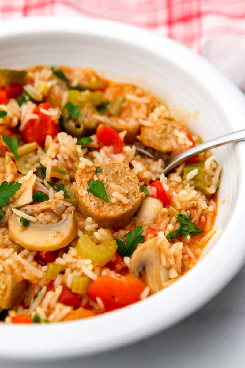 A white bowl filled with vegan jambalaya.