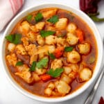 A top view of a bowl of vegan posole made with butler soy curls.