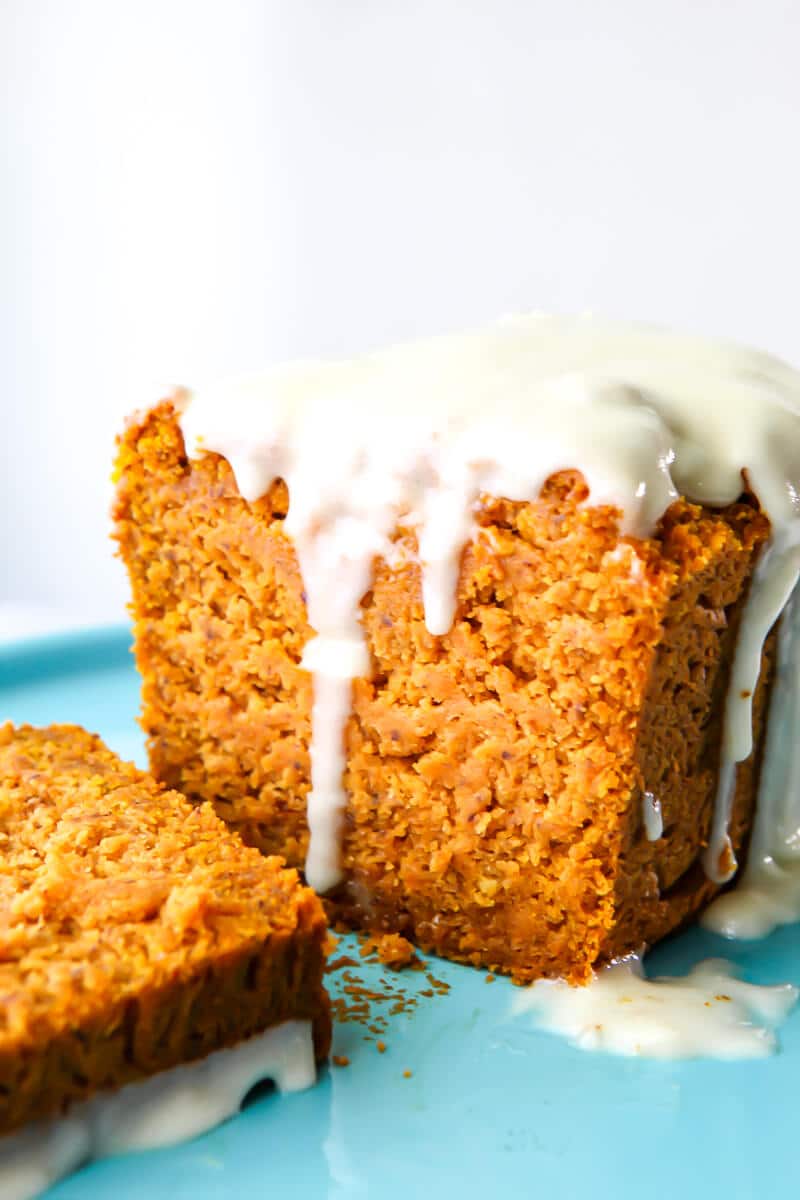 A close up of a vegan pumpkin loaf on a blue plate.