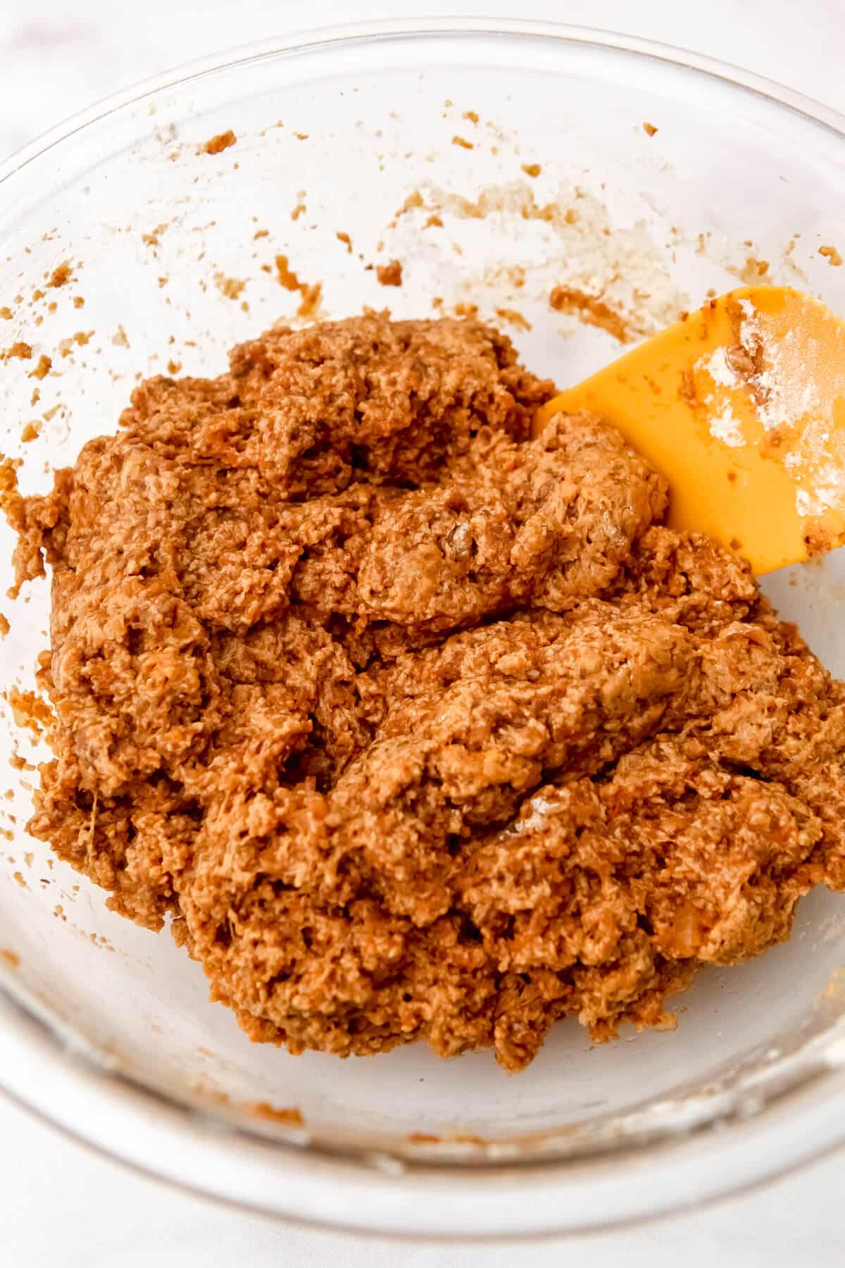 Seitan ribs dough mixed in a large glass bowl.