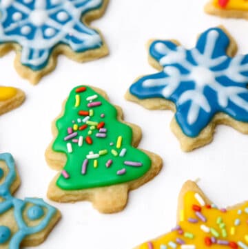 Cut out cookies in the shape of stars, Christmas trees, and snowflakes decorated with vegan royal icing.