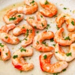 A close up of vegan shrimp cooking in an skillet.